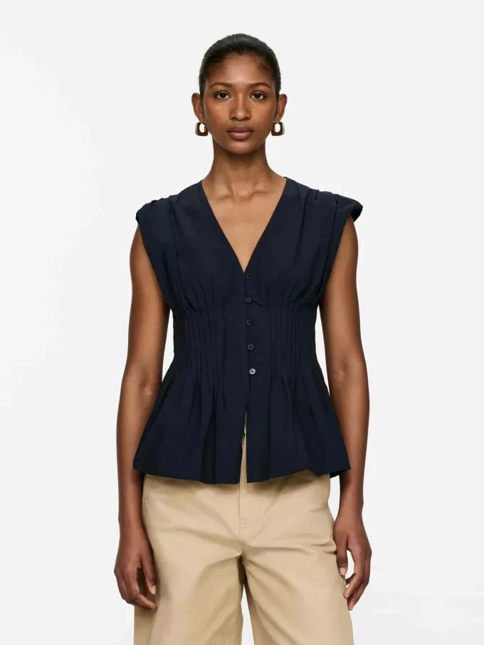 Top con nervature con orlo a palloncino Top con nervature con orlo a palloncino